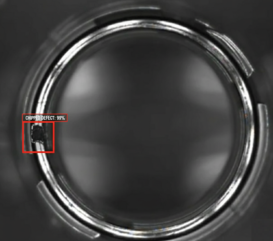 Close-up visual inspection of a chipped glass bottle rim